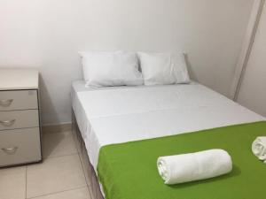 Postel nebo postele na pokoji v ubytování Helecho's Hostal