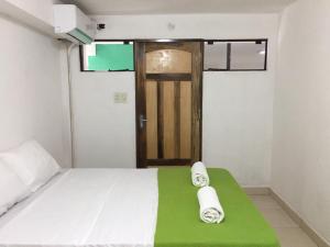 Postel nebo postele na pokoji v ubytování Helecho's Hostal