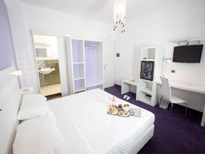Posteľ alebo postele v izbe v ubytovaní Hotel Bruman