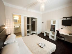 Posteľ alebo postele v izbe v ubytovaní Hotel Bruman