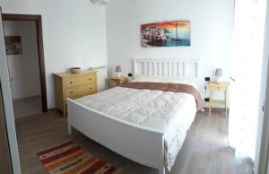 A bed or beds in a room at Alle Porte di Genova