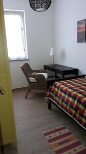 A bed or beds in a room at Alle Porte di Genova