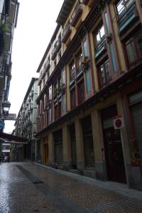 an empty street in a city with buildings at Loft 7calles, Casco Viejo. Bio in Bilbao