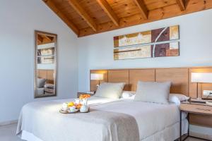 a white bedroom with two beds and a desk at Ona Alanda Club Marbella in Marbella
