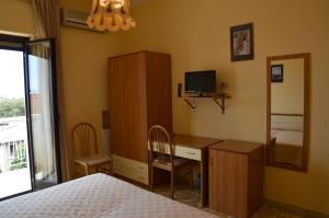 TV a/nebo společenská místnost v ubytování Hotel Virgilio