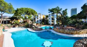 a swimming pool at a resort with a resort at Ona Alanda Club Marbella in Marbella