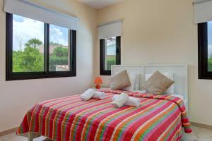 a bedroom with a bed with two pillows on it at Villa Pashiana in Polis Chrysochous +11 photos