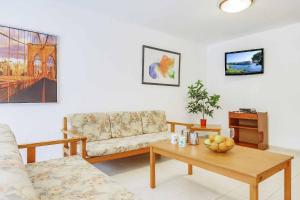 a living room with a couch and a coffee table at Villa Pou Uno in Santanyi