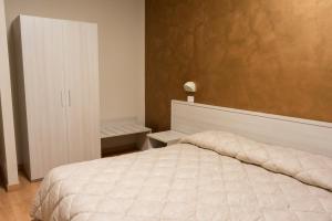 Postel nebo postele na pokoji v ubytování Hotel Cecco