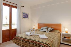 Ein Bett oder Betten in einem Zimmer der Unterkunft Villa Animeta