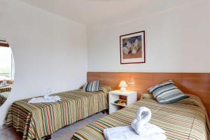 Ein Bett oder Betten in einem Zimmer der Unterkunft Villa Animeta