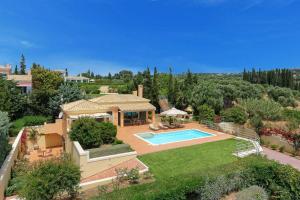 an aerial view of a house with a swimming pool at Villa Riaki in Kaligata
