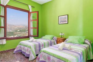 Posteľ alebo postele v izbe v ubytovaní Villa Lizar + 13 fotografií