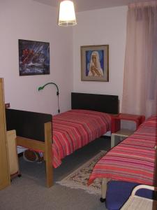 Cama o camas de una habitación en Residenza Nido del Fagiano