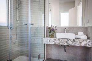 a bathroom with a shower and a sink at Villa Del Cielo in Vlachata +25 photos