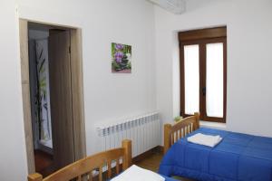 Postel nebo postele na pokoji v ubytování Albergue Vive tu Camino