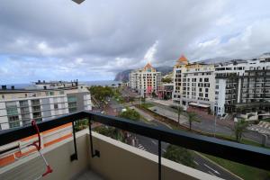 a balcony with a view of a city with buildings at Duas Torres - Appartment in Funchal