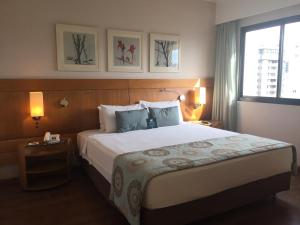 Una cama o camas en una habitación de Moema Residencial 25 fotos más