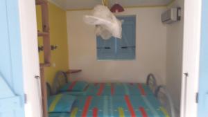 Letto o letti in una camera di ti case gwada location