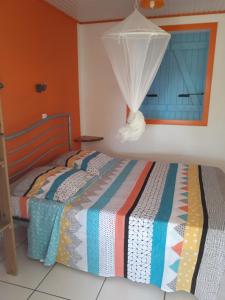 Letto o letti in una camera di ti case gwada location