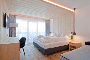 Ένα ή περισσότερα κρεβάτια σε δωμάτιο στο Hotel Garni Broi - Charme & Relax
