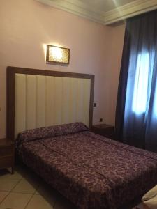 Postel nebo postele na pokoji v ubytování Hotel Boustane