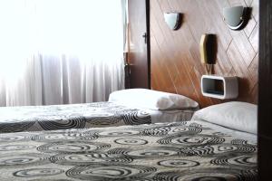 Postel nebo postele na pokoji v ubytování Hostal Sanmar + 25 fotografií
