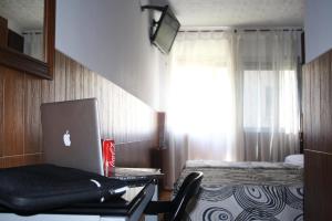 Postel nebo postele na pokoji v ubytování Hostal Sanmar