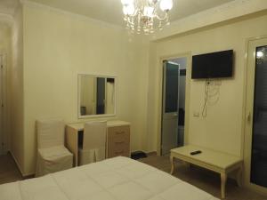 TV a/nebo společenská místnost v ubytování Hotel 3 Vellezerit