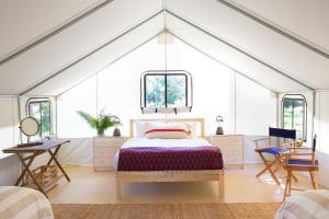 a bedroom with a bed in a tent at Mendocino Grove in Mendocino