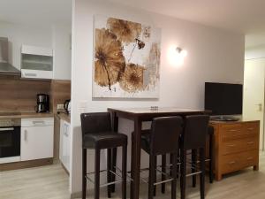 Kuchyň nebo kuchyňský kout v ubytování Apartment Metzingen City