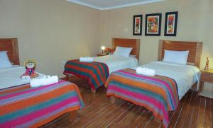 Llit o llits en una habitació de Eco Aventura Hostel Cusco