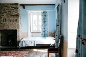 La Vieille Foulonnière : Chambres d'hôtes & Permaculture的休息区