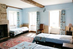 La Vieille Foulonnière : Chambres d'hôtes & Permaculture客房内的一张或多张床位