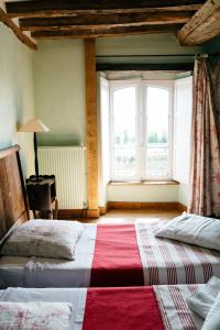 La Vieille Foulonnière : Chambres d'hôtes & Permaculture客房内的一张或多张床位