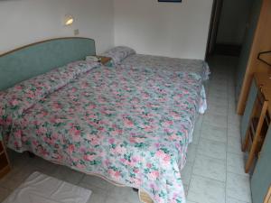 Ένα ή περισσότερα κρεβάτια σε δωμάτιο στο Hotel Vecchia Rimini