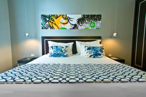 Cama ou camas em um quarto em Internacional Design Hotel