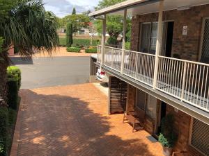 a balcony of a house with a car on it at City Motor Inn in Toowoomba