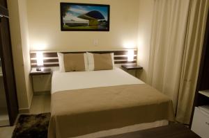 Cama ou camas em um quarto em Bristol Portal do Iguaçu Curitiba Aeroporto