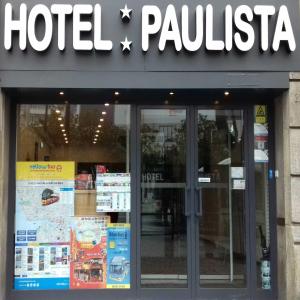 a store front with a sign on the front of it at Hotel Paulista in Porto