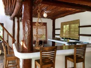 a kitchen with a table and chairs at La Casa de Mia Tulum in Tulum