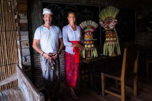 a man and a woman posing for a picture at Ryanbagus Guest House in Canggu