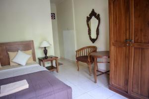 Postel nebo postele na pokoji v ubytování Ubud Canti House