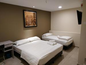 Postel nebo postele na pokoji v ubytování M Design Hotel @ Bangi 7