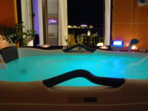 a jacuzzi tub in a hotel room at night at Vistas de Ronda in Ronda