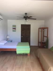 Postel nebo postele na pokoji v ubytování Villa Sueño Potrero