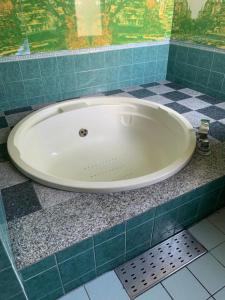 a bath tub sitting on a counter in a bathroom at Hotel Festa (Adult Only) in Narita