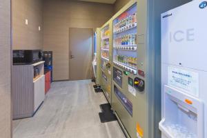 a convenience store aisle with a ice machine at Hotel Route-inn Yamaguchi Yuda Onsen in Yamaguchi