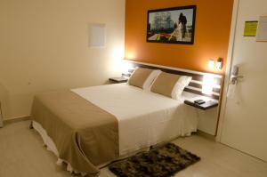 Cama ou camas em um quarto em Bristol Portal do Iguaçu Curitiba Aeroporto