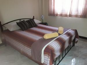 Postel nebo postele na pokoji v ubytování Wattle Inn